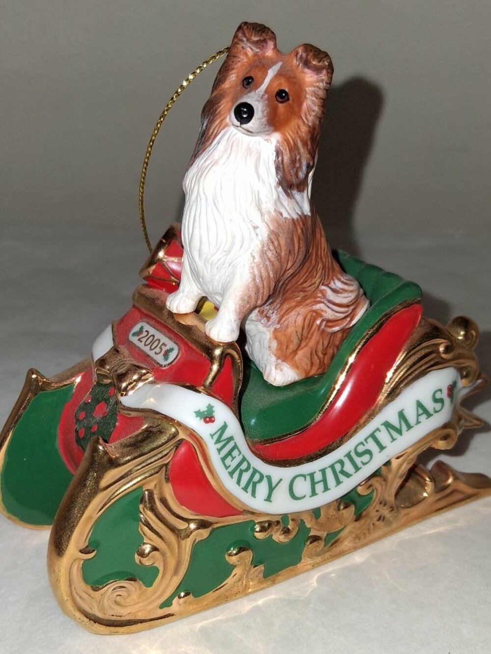 Danbury Mint SHELTIE Ornament 2005 in Sled ornament too cute